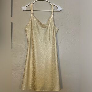 Vintage cream silky slip dress with bow details on the straps. Marked as size L